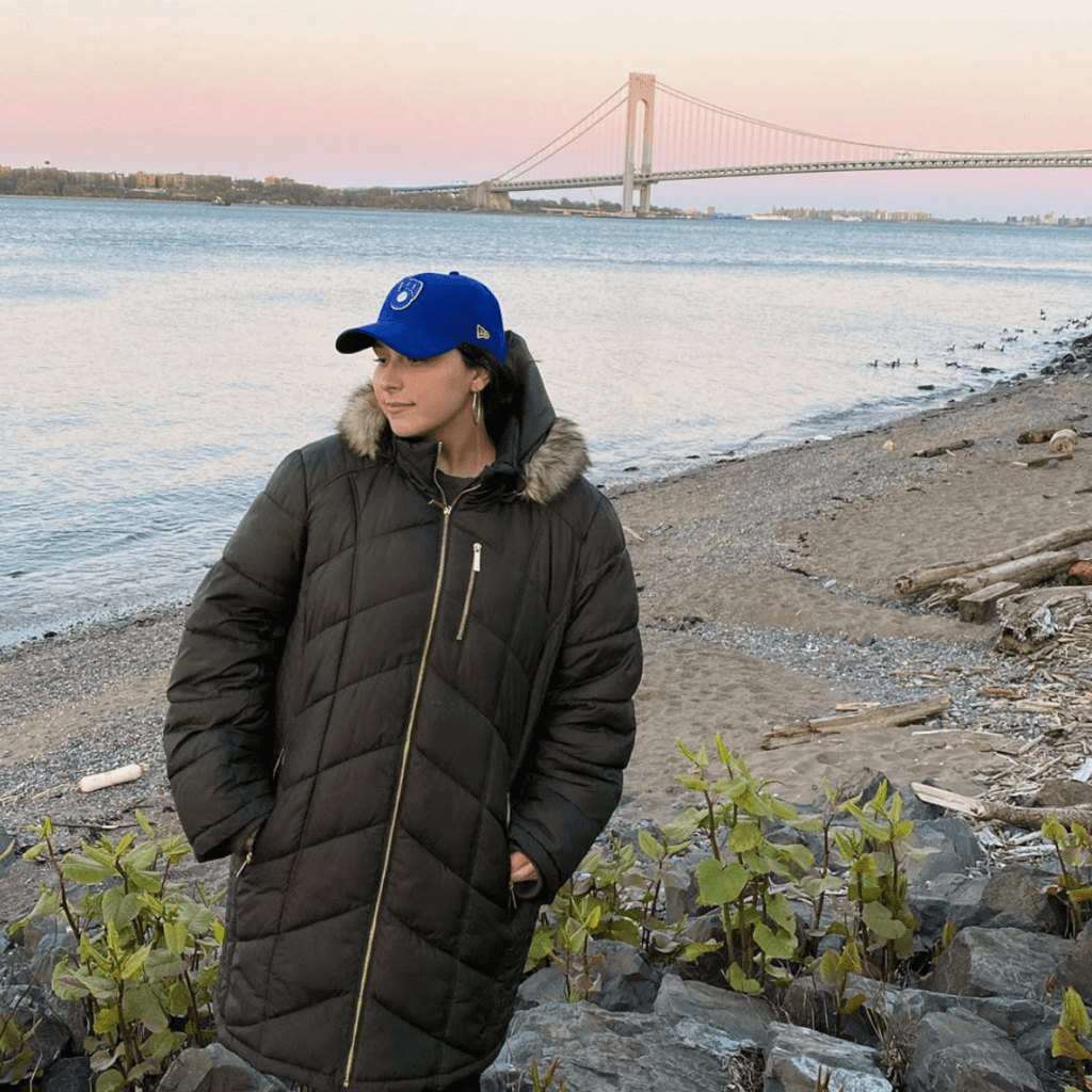 woman in front of bridge