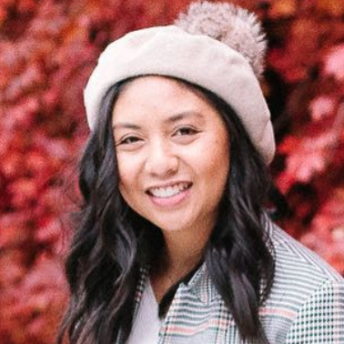 Rach smiling against fall leaves