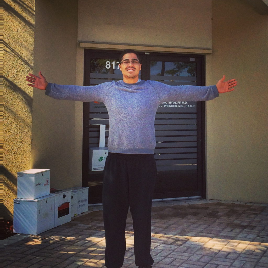 Emmanuel S. arms outstretched