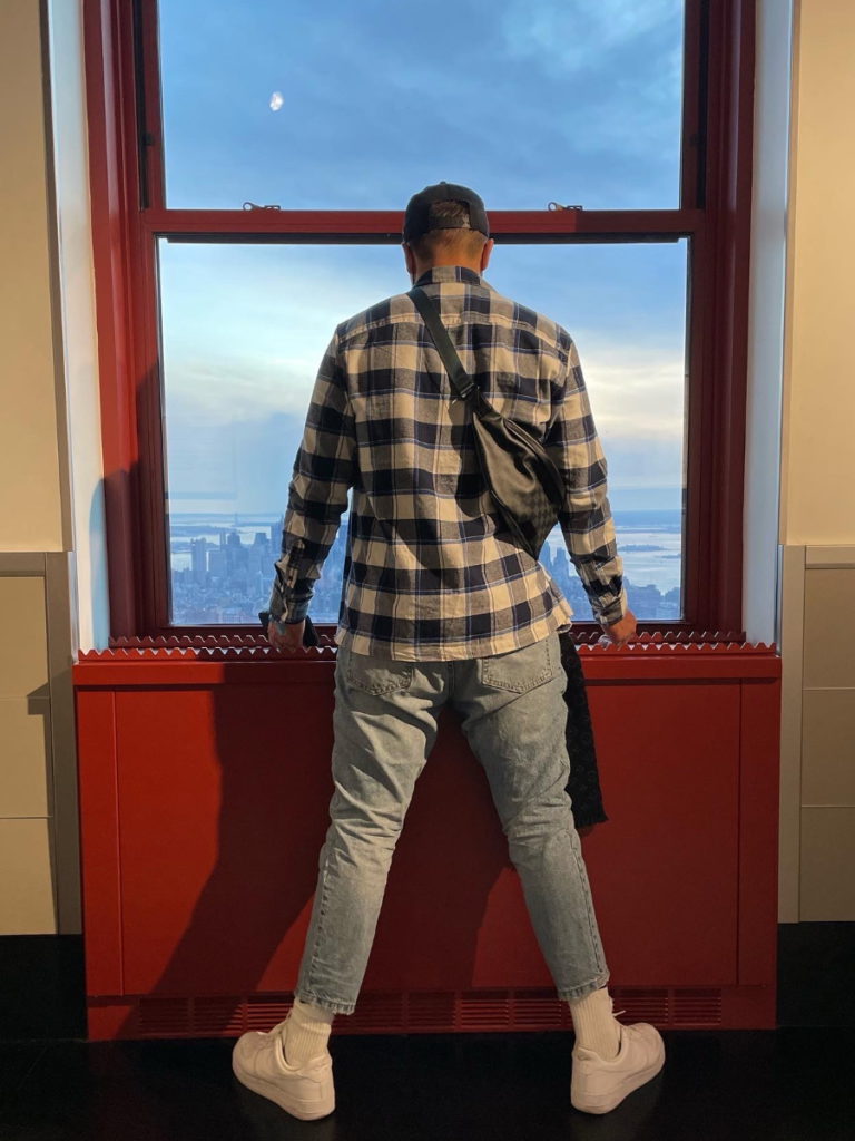 Emmanuel S. looking out a window