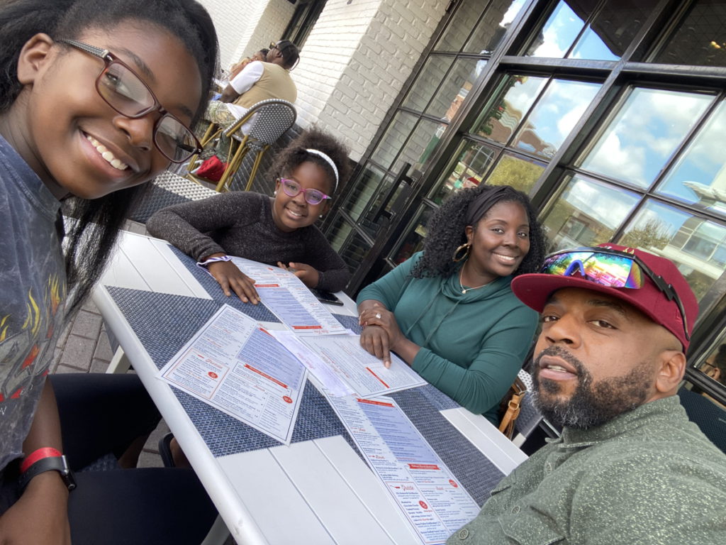 Mical R. dining out with family