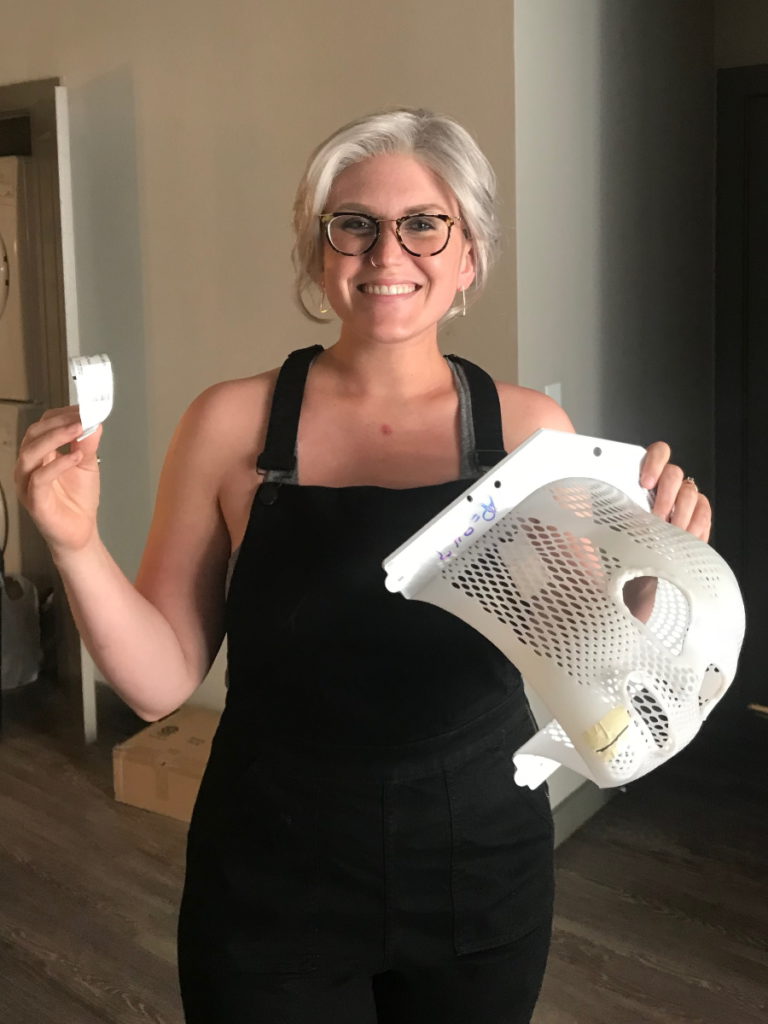 Kelsey R. holding a head mold