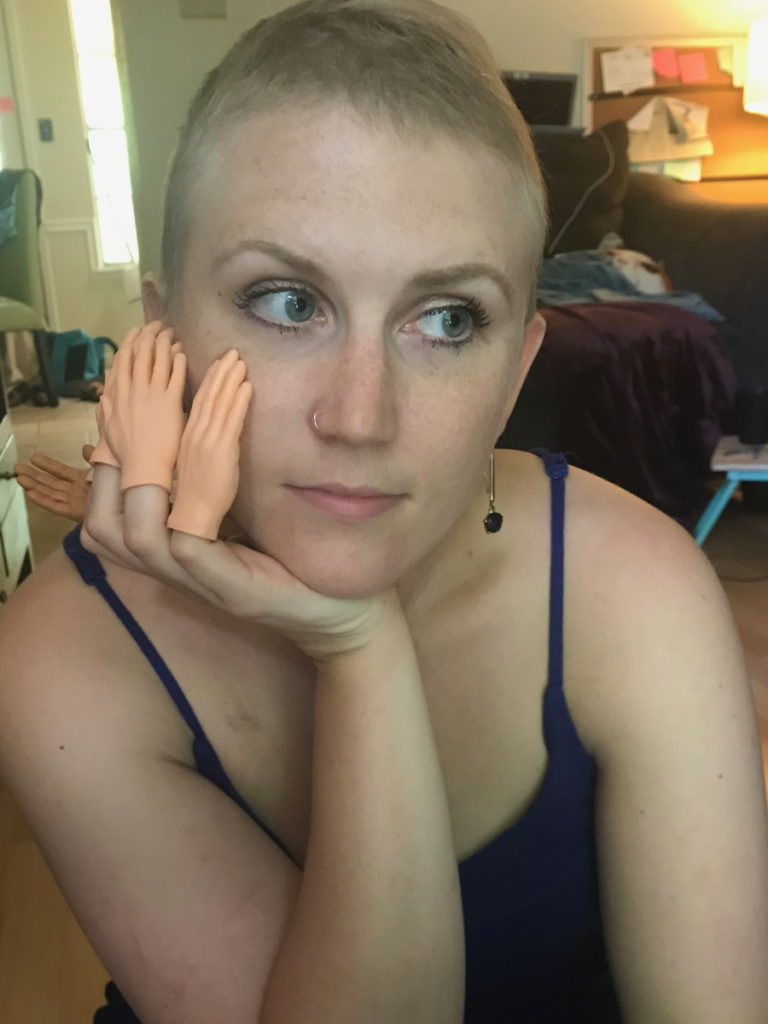 Kelsey R. wearing tiny hands