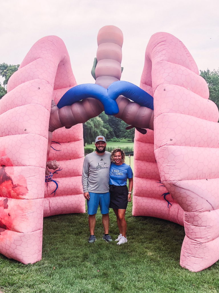 Dan W. and wife inside inflatable lungs