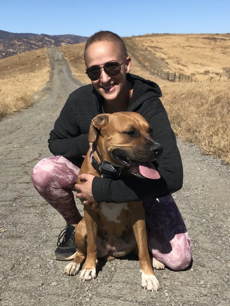 Samantha S. and dog on the road