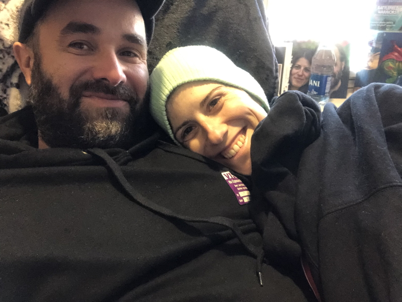 Anna T. and husband Joe in black hoodies