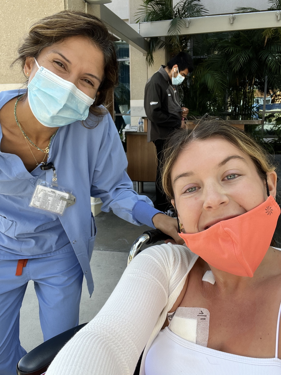 Paige C. in wheelchair with nurse