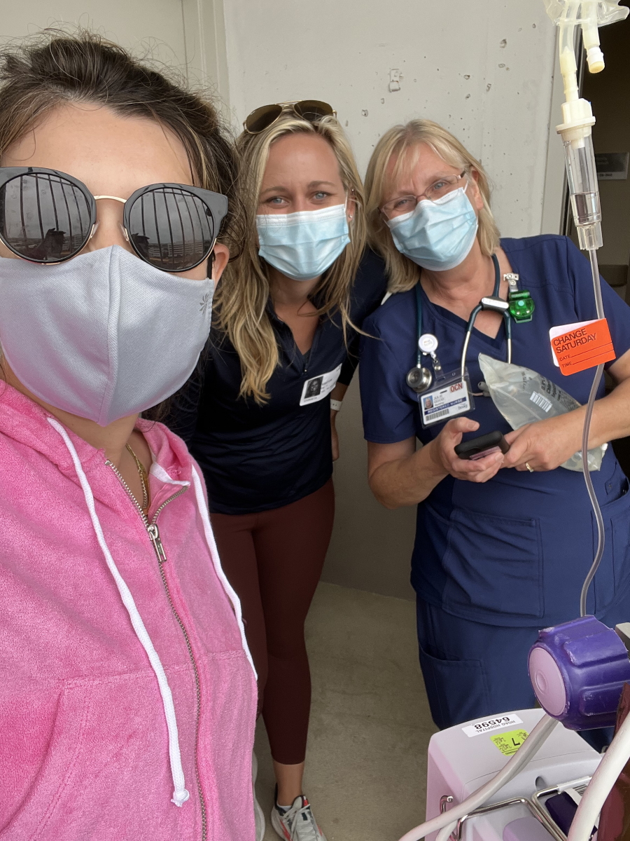 Paige C. with nurses outside