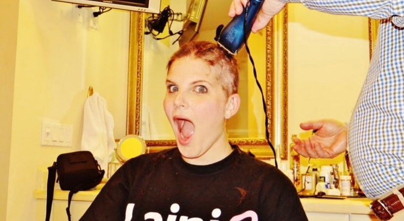 Lainie J. hair being shaved off