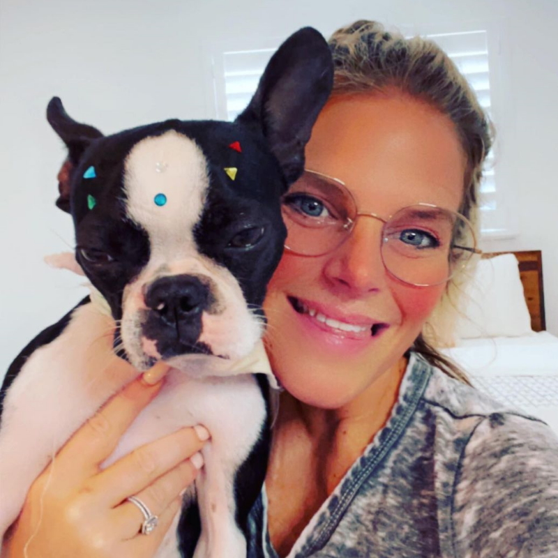 Lainie J. in bedroom with dog