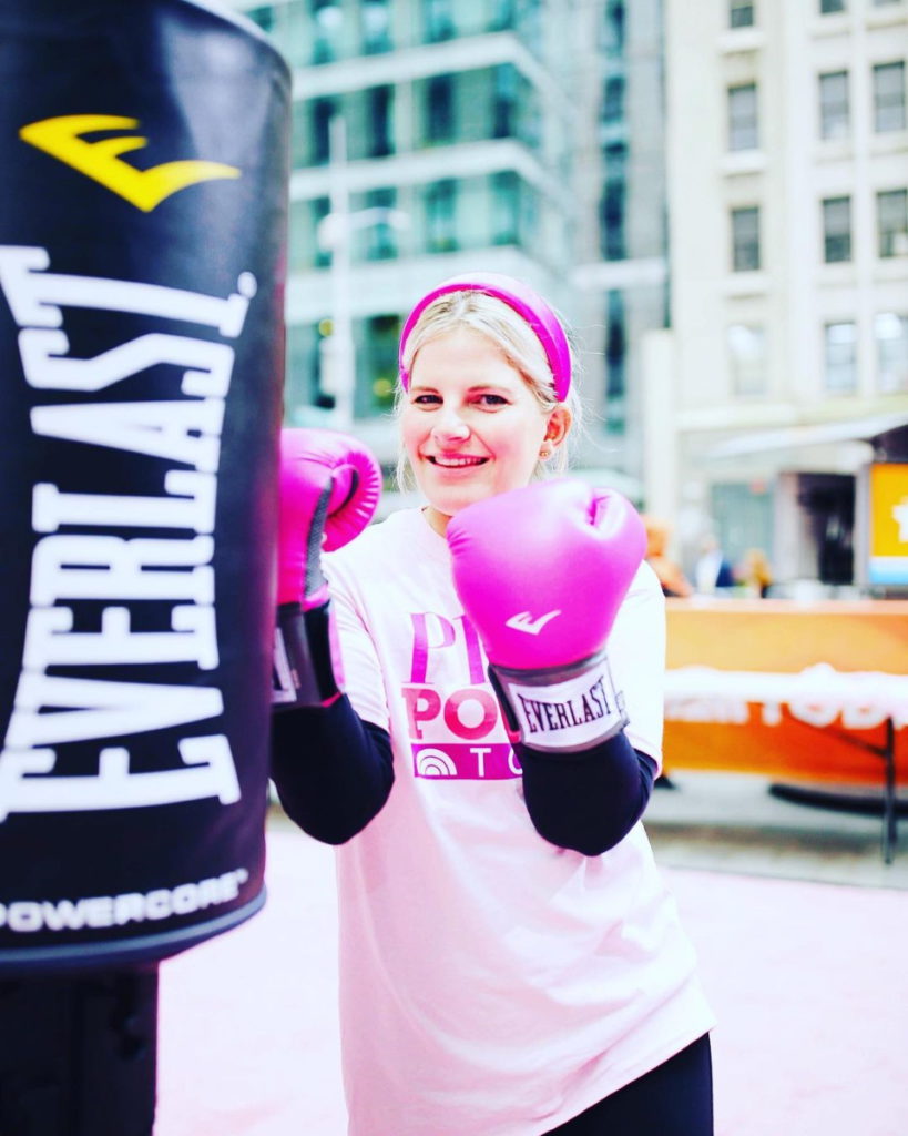 Lainie J. wearing pink boxing gloves