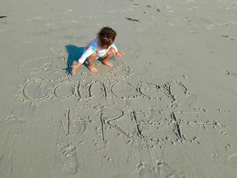 Renee F. cancer-free written on sand