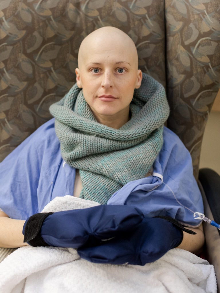 Chelsey P. seated during treatment