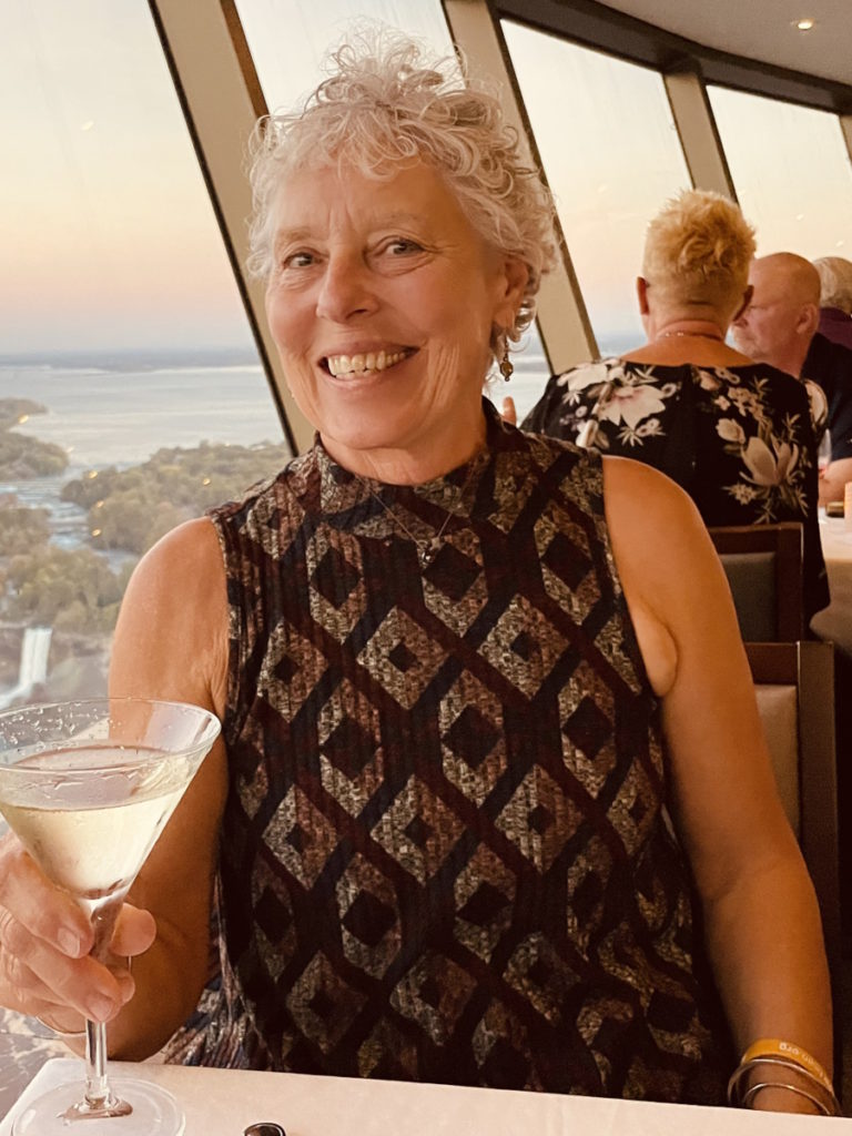 Vickie D. dine out wine glass in hand