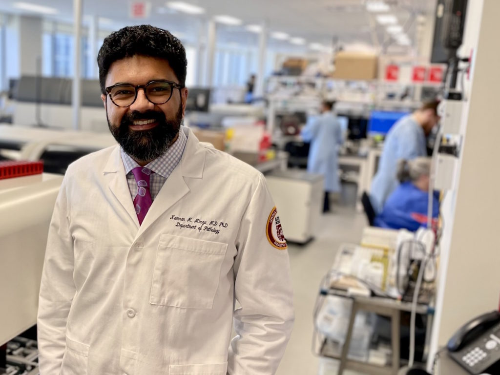 Dr. Kamran Mirza working as a pathologist