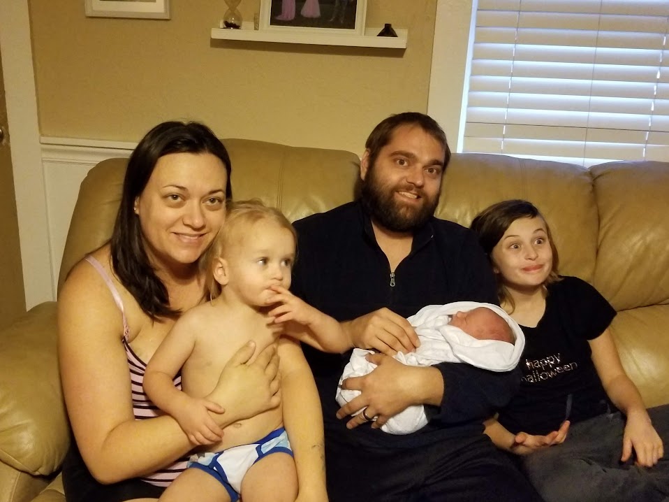 Jason with his wife and kids